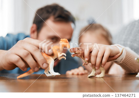 Playing, dinosaur and the hands of a father and child for bonding, childhood and on a table. Closeup, together and a man, dad or kid with a toy for happiness, entertainment or family in a house Playing, dinosaur and the hands of a father and child for bonding, childhood and on a table. Closeup, together and a man, dad or kid with a toy for happiness, entertainment or family in a house 137464271