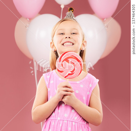 Balloons, lollipop and portrait of girl on pink background for birthday party, celebration and special day. Happy, excited and young cute child smile with candy, sweet treats and dessert in studio Balloons, lollipop and portrait of girl on pink background for birthday party, celebration and special day. Happy, excited and young cute child smile with candy, sweet treats and dessert in studio 137464305