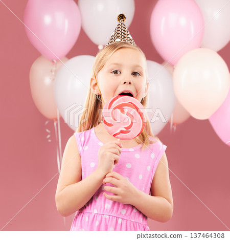 Balloons, lollipop and portrait of child on pink background for birthday party, celebration and special day. Happy, excited and young cute girl smile with candy, sweet treats and dessert in studio Balloons, lollipop and portrait of child on pink background for birthday party, celebration and special day. Happy, excited and young cute girl smile with candy, sweet treats and dessert in studio 137464308
