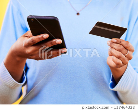 Woman, hands and phone with credit card in online shopping, payment or banking for eft or purchase. Closeup of female person or shopper with debit and mobile smartphone app in ecommerce or buying Woman, hands and phone with credit card in online shopping, payment or banking for eft or purchase. Closeup of female person or shopper with debit and mobile smartphone app in ecommerce or buying 137464328