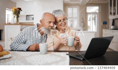 Laptop, video call and senior couple in a kitchen with coffee, conversation and bond at home. Love, retirement and elderly man with old woman in a house with tea, speaking or online communication Laptop, video call and senior couple in a kitchen with coffee, conversation and bond at home. Love, retirement and elderly man with old woman in a house with tea, speaking or online communication 137464409