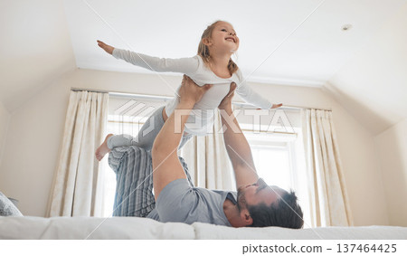 Child, dad and happy on bed for airplane games, support and relax for crazy fun in house. Father, girl kid and excited to fly in bedroom for freedom, fantasy and balance for play, trust and energy Child, dad and happy on bed for airplane games, support and relax for crazy fun in house. Father, girl kid and excited to fly in bedroom for freedom, fantasy and balance for play, trust and energy 137464425