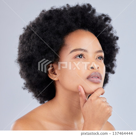 Thinking, serious and a black woman on a studio background for skincare, dermatology or health idea. Makeup, cosmetics and an african model or person with vision for a glow or wellness with a plan Thinking, serious and a black woman on a studio background for skincare, dermatology or health idea. Makeup, cosmetics and an african model or person with vision for a glow or wellness with a plan 137464444