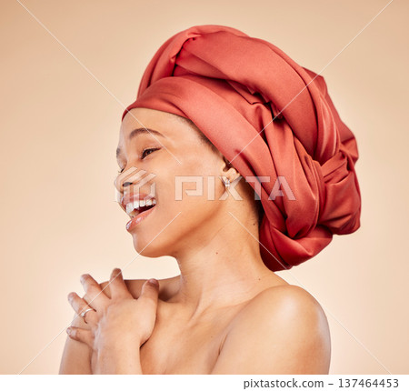 Natural beauty, woman and head wrap in studio, smile and cosmetic for skincare and face glow on beige background. Cosmetology, wellness and person with makeup for happiness, confidence and self care Natural beauty, woman and head wrap in studio, smile and cosmetic for skincare and face glow on beige background. Cosmetology, wellness and person with makeup for happiness, confidence and self care 137464453