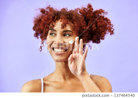 Skincare, studio face or happy woman with cream for wellness care, skin protection and test facial hydration product. Sunscreen, happiness or clean person with cosmetics ointment on purple background Skincare, studio face or happy woman with cream for wellness care, skin protection and test facial hydration product. Sunscreen, happiness or clean person with cosmetics ointment on purple background 137464540