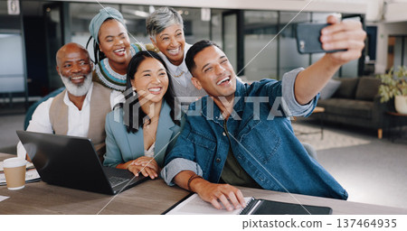 Selfie, meeting and planning with friends in the office together taking a picture for memory. Collaboration, smile and diversity with a happy business team in a creative workplace for a photograph Selfie, meeting and planning with friends in the office together taking a picture for memory. Collaboration, smile and diversity with a happy business team in a creative workplace for a photograph 137464935