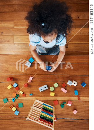Above, child and toys for learning on the floor, home education and fun activity. House, young and a girl kid with blocks and abacus for recreation, math or perspective on the ground in childhood 137465546