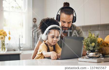 Father, child and laptop with headphones, home or happy for movie, music or streaming subscription. Dad, kid and computer for education, learning or help for online course in interracial family house 137465567