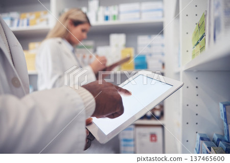 Tablet screen, person and pharmacist hands typing, scroll or search clinic database for product, pills or medicine. Pharmacy inventory, online research and closeup doctor doing supplements stock take Tablet screen, person and pharmacist hands typing, scroll or search clinic database for product, pills or medicine. Pharmacy inventory, online research and closeup doctor doing supplements stock take 137465600