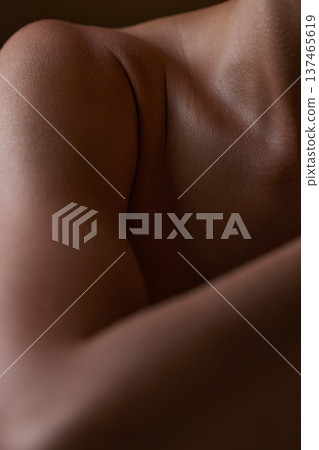 Body, closeup and healthy skin of black woman, shoulder or natural glow from skincare in studio with antiaging cosmetics. Beauty, self care and arm of model with clean, hygiene and aesthetic wellness Body, closeup and healthy skin of black woman, shoulder or natural glow from skincare in studio with antiaging cosmetics. Beauty, self care and arm of model with clean, hygiene and aesthetic wellness 137465619