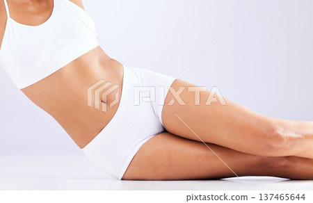 Skincare, health and stomach of woman in studio for healthy body, wellness and weightloss. Fitness, lose weight and abdomen of person on white background in underwear for diet, detox and self care Skincare, health and stomach of woman in studio for healthy body, wellness and weightloss. Fitness, lose weight and abdomen of person on white background in underwear for diet, detox and self care 137465644