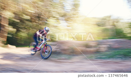 Blur, race and man cycling in nature training for a competition on trail in forest or woods. Action, sports or fast cyclist athlete riding bicycle at speed for cardio exercise, fitness or workout Blur, race and man cycling in nature training for a competition on trail in forest or woods. Action, sports or fast cyclist athlete riding bicycle at speed for cardio exercise, fitness or workout 137465646