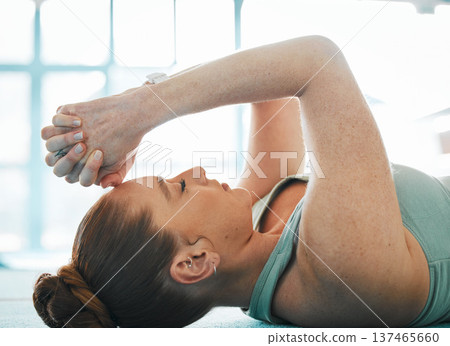Stress, tired and a sports woman on the floor, lying down to relax after an intense workout or training. Fitness, exercise and fatigue with an exhausted female athlete in the gym for gymnastics Stress, tired and a sports woman on the floor, lying down to relax after an intense workout or training. Fitness, exercise and fatigue with an exhausted female athlete in the gym for gymnastics 137465660