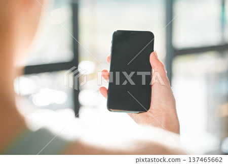 Woman, hand and phone mockup in advertising, social media or online communication at home. Closeup of female person with mobile smartphone app, display or screen for research, texting or networking Woman, hand and phone mockup in advertising, social media or online communication at home. Closeup of female person with mobile smartphone app, display or screen for research, texting or networking 137465662