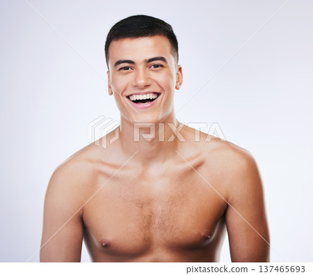 Happy man, portrait and skincare with facial and beauty treatment for skin glow and wellness in studio. Male model smile, dermatology and cosmetics for relax face with white background and confidence Happy man, portrait and skincare with facial and beauty treatment for skin glow and wellness in studio. Male model smile, dermatology and cosmetics for relax face with white background and confidence 137465693