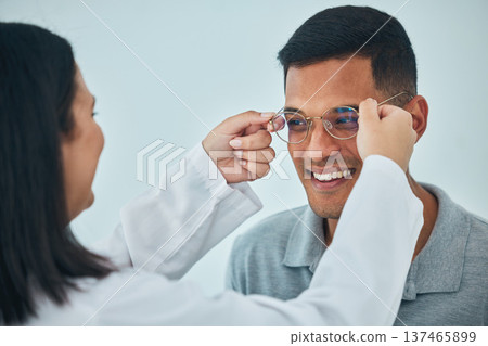 Glasses, eye care and vision, optometrist and patient with help and eyewear choice, prescription and lens. Wire frame, smile and people at optometry clinic during consultation, healthcare and test 137465899