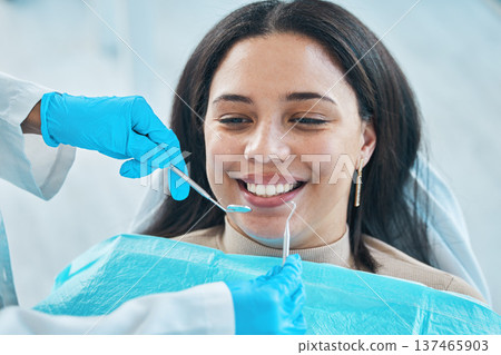 Dentist, hands and patient, woman and teeth whitening, metal tools for dental procedure and healthcare. Smile, tooth decay and veneers treatment, excavator and wellness with oral health at clinic Dentist, hands and patient, woman and teeth whitening, metal tools for dental procedure and healthcare. Smile, tooth decay and veneers treatment, excavator and wellness with oral health at clinic 137465903