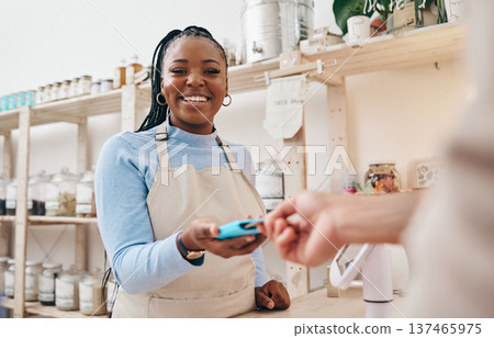 Sustainable store, woman cashier and credit card with shop and electronic transaction with small business. Worker smile, entrepreneur and happy African person with retail employee and shopping pay Sustainable store, woman cashier and credit card with shop and electronic transaction with small business. Worker smile, entrepreneur and happy African person with retail employee and shopping pay 137465975