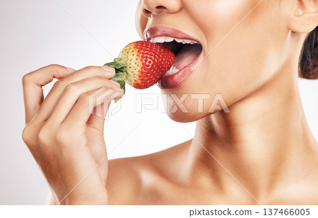 Woman, strawberry and mouth for eating, studio and healthy with nutrition, diet and bite by white background. Girl, model and fruit for wellness, detox or cosmetics with detox, vitamin or vegan meal Woman, strawberry and mouth for eating, studio and healthy with nutrition, diet and bite by white background. Girl, model and fruit for wellness, detox or cosmetics with detox, vitamin or vegan meal 137466005