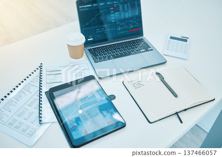 Technology, office desk and trading, stock market and paperwork, finance and statistics information. Calculator, notebook with tablet and laptop, screen and data analytics with documents and fintech Technology, office desk and trading, stock market and paperwork, finance and statistics information. Calculator, notebook with tablet and laptop, screen and data analytics with documents and fintech 137466057
