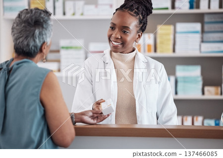 Pharmacist, pharmacy and customer for medicine service, healthcare advice and clinic solution or support by counter. African doctor, women or medical people with box of pills, product or retail drugs Pharmacist, pharmacy and customer for medicine service, healthcare advice and clinic solution or support by counter. African doctor, women or medical people with box of pills, product or retail drugs 137466085