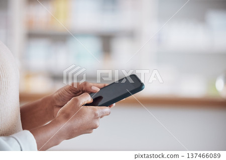 Woman pharmacist with smartphone, typing in clinic and research for medical information, email or online chat. Phone, networking and mockup, doctor in pharmacy checking social media or internet news Woman pharmacist with smartphone, typing in clinic and research for medical information, email or online chat. Phone, networking and mockup, doctor in pharmacy checking social media or internet news 137466089
