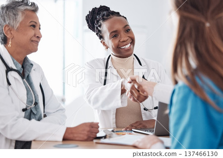 Happy nurses, teamwork or doctors shaking hands for interview, good job or promotion success in meeting. Hospital, congratulations or proud healthcare worker with handshake for medical collaboration Happy nurses, teamwork or doctors shaking hands for interview, good job or promotion success in meeting. Hospital, congratulations or proud healthcare worker with handshake for medical collaboration 137466130