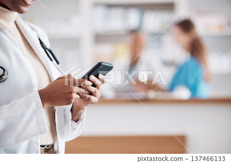 Woman pharmacist with phone, typing in clinic and research for medical information, email or online chat. Smartphone, networking and mockup, doctor in pharmacy checking social media or internet news Woman pharmacist with phone, typing in clinic and research for medical information, email or online chat. Smartphone, networking and mockup, doctor in pharmacy checking social media or internet news 137466133