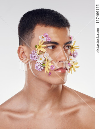 Thinking, creative and a man with flowers on a studio background for ecology or nature aesthetic. Floral, serious and a male model with plants for facial cosmetics, skincare or an idea on a backdrop Thinking, creative and a man with flowers on a studio background for ecology or nature aesthetic. Floral, serious and a male model with plants for facial cosmetics, skincare or an idea on a backdrop 137466135