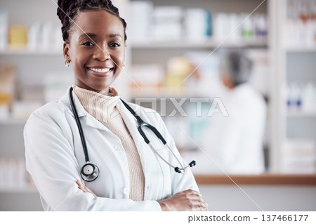Black woman, doctor in portrait with arms crossed and healthcare, medical professional and hospital dispensary. Pharmacy, health and confidence, smile with wellness and drugs, medicine and service Black woman, doctor in portrait with arms crossed and healthcare, medical professional and hospital dispensary. Pharmacy, health and confidence, smile with wellness and drugs, medicine and service 137466177