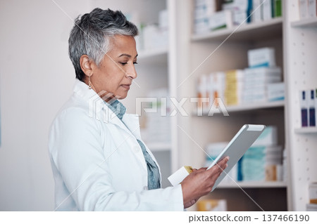 Woman, pharmacist and tablet technology, medicine shelf or healthcare inventory of boxes or stock management. Medical, pharmacy or mature doctor reading pills, product package or drugs in e commerce 137466190