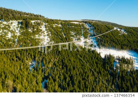 Sky Bridge 721 is the longest suspension bridge between two hills in the forest in winter, Dolni Morava, Czech Republic 137466354