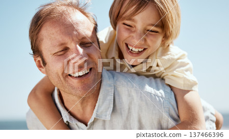 Happy father, child and laughing in piggyback, family bonding or outdoor weekend on holiday or summer break. Dad and son in hug, love or care for embrace, childhood or enjoying day together in nature 137466396