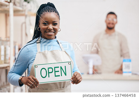 Open, sign or black woman with small business or restaurant happy for service in coffee shop, cafe or store with board. Smile, manager and portrait of entrepreneur ready for operations with billboard Open, sign or black woman with small business or restaurant happy for service in coffee shop, cafe or store with board. Smile, manager and portrait of entrepreneur ready for operations with billboard 137466458