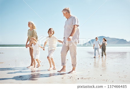 Grandparents, kids and holding hands on beach, family and parents with trust and support, tropical holiday and travel. Happiness, nature and sea with love and care, generations and people on vacation 137466485