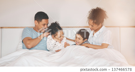 Happy, tickle and relax with family in bedroom for playful, morning and love. Care, support and wake up with parents and children laughing in bed at home for weekend, positive and resting together Happy, tickle and relax with family in bedroom for playful, morning and love. Care, support and wake up with parents and children laughing in bed at home for weekend, positive and resting together 137466578
