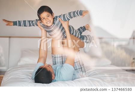 Kid, father and smile on bed for airplane games, support and relax at home for crazy fun. Portrait, dad and boy child excited to fly in bedroom for freedom, fantasy or balance of play, care or energy 137466580