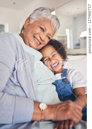 Portrait, hug and grandma with girl, smile and bonding with weekend break, love and care in a living room. Face, granny or kid with happiness, home and support in a lounge, family or loving together 137466737