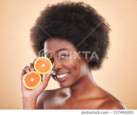 Orange skincare, portrait and woman on studio background for natural cosmetics, healthy benefits and nutrition. Happy african beauty model with citrus fruits for vitamin c, detox and eco dermatology 137466895