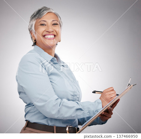 Clipboard, writing and portrait of senior woman in a studio planning, brainstorming or working on a schedule. Happy, smile and elderly female model with paper list and pen isolated by gray background Clipboard, writing and portrait of senior woman in a studio planning, brainstorming or working on a schedule. Happy, smile and elderly female model with paper list and pen isolated by gray background 137466950
