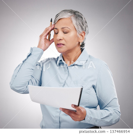 Business woman, headache and stress for documents, financial paperwork and taxes, audit or debt in studio. Professional manager or mature person in pain or frustrated for budget on a white background 137466954