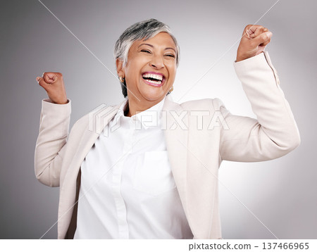 Strong, laughing and portrait of a woman on a studio background for a professional career. Happy, funny and a mature manager or employee showing power, muscle or confidence isolated on a backdrop Strong, laughing and portrait of a woman on a studio background for a professional career. Happy, funny and a mature manager or employee showing power, muscle or confidence isolated on a backdrop 137466965