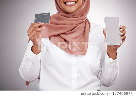 Woman, hands and credit card with phone screen, fashion e commerce and online shopping mockup in studio. Happy muslim or islamic person with mobile fintech, banking and payment on a white background Woman, hands and credit card with phone screen, fashion e commerce and online shopping mockup in studio. Happy muslim or islamic person with mobile fintech, banking and payment on a white background 137466974