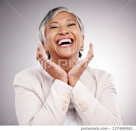 Funny, portrait and beauty of mature woman in suit in studio isolated on a white background. Face hands, makeup cosmetics and excited model with laugh in spa facial treatment for skincare antiaging Funny, portrait and beauty of mature woman in suit in studio isolated on a white background. Face hands, makeup cosmetics and excited model with laugh in spa facial treatment for skincare antiaging 137466981