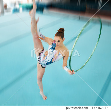 Fitness, dance with a gymnastics hoop and a woman in the gym for a performance showcase or practice. Training, energy and concert with a female athlete on a studio floor for routine or recital 137467116