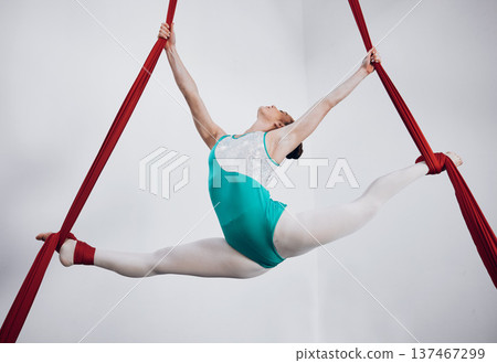 Gymnast, woman acrobat with performance and sports, fitness and art with athlete on white background. Gymnastics, training and exercise with creativity, talent with fabric and competition in studio Gymnast, woman acrobat with performance and sports, fitness and art with athlete on white background. Gymnastics, training and exercise with creativity, talent with fabric and competition in studio 137467299