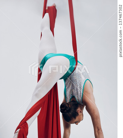 Gymnastics, woman acrobat with fabric and sports, fitness and art with athlete on white background. Gymnast, training and exercise with creativity, talent with performance and competition in studio Gymnastics, woman acrobat with fabric and sports, fitness and art with athlete on white background. Gymnast, training and exercise with creativity, talent with performance and competition in studio 137467302