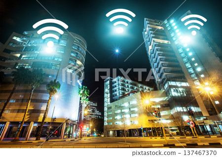 Cityscape, internet and night, wireless connectivity with building, technology abstract and communication online. Location, connection and urban street landscape, cyber and digital transformation Cityscape, internet and night, wireless connectivity with building, technology abstract and communication online. Location, connection and urban street landscape, cyber and digital transformation 137467370