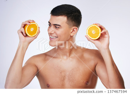 Beauty, orange and skincare with face of man in studio for health, detox and natural cosmetics. Vitamin c, nutrition and summer with person and fruit on white background for self care and glow 137467594