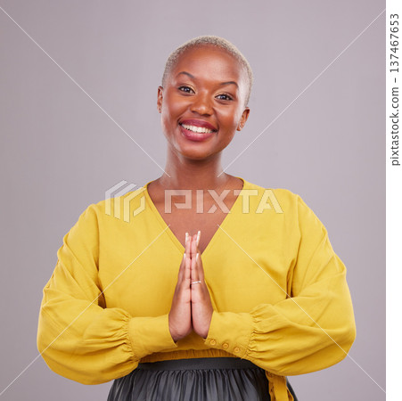 Woman, praying and hands together in religion, faith and hope or thank you of career opportunity on studio background. Christian or African person in gratitude portrait, peace emoji and ngo business 137467653